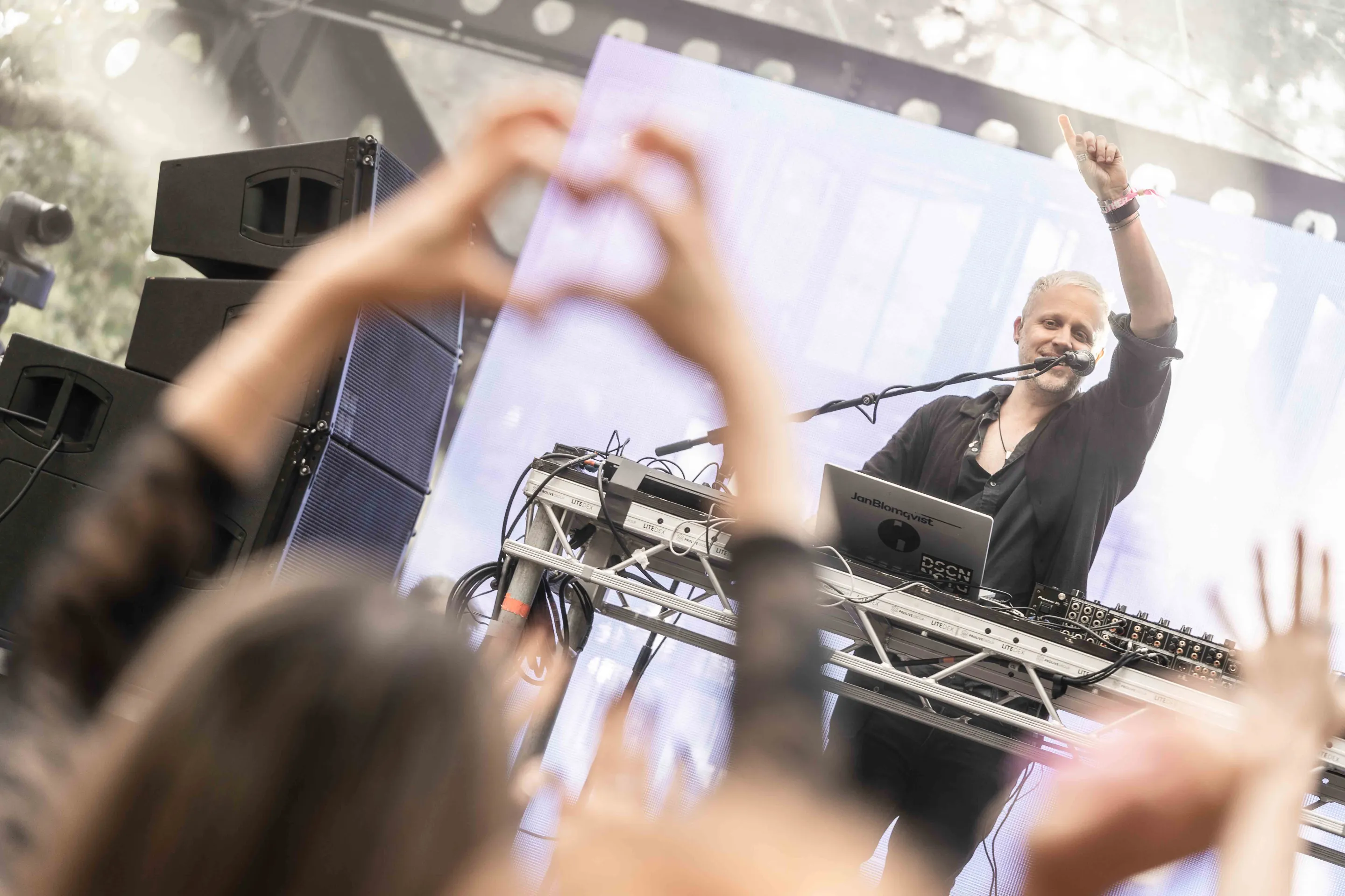 Live concert photography capturing musicians performing on stage with dynamic lighting and energetic crowd engagement.